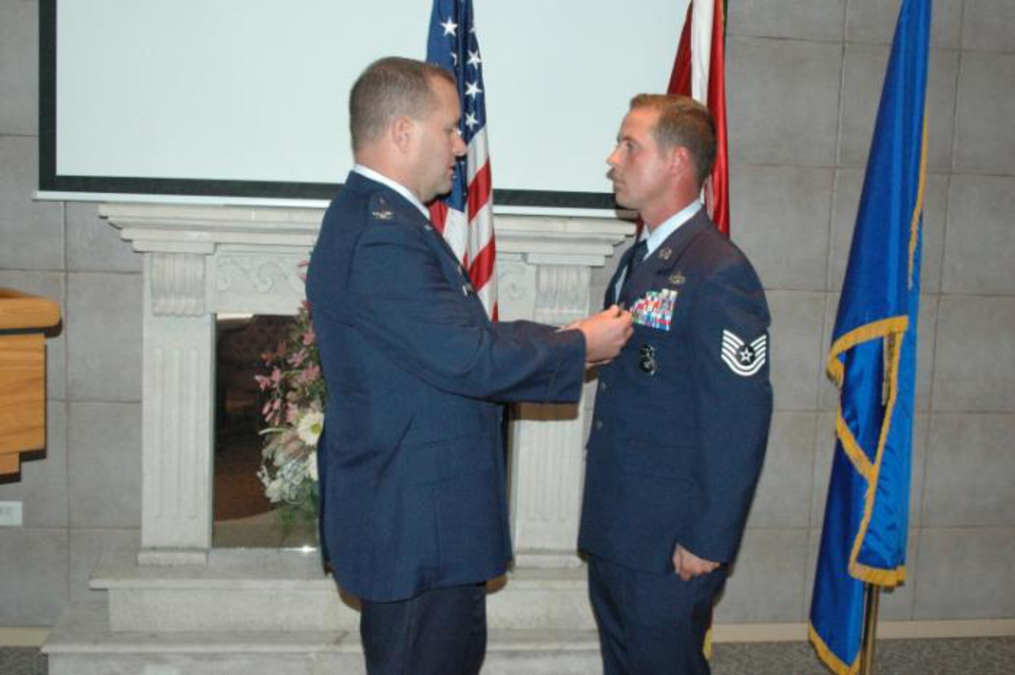 Col. Richard Robel (left), 425th Air Base Group commander, presents the Bronze Star to Tech. Sgt. James Thompson, 425th ABG Anti-Terrorism Force Protection officer, Oct. 20 at the Izmir Collocated Club. TSgt Thompson was awarded Bronze Star for his heroic efforts during a 12-month deployment to Iraq.