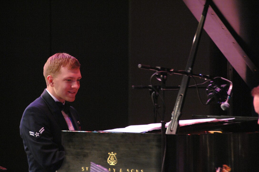 Airman First Class Michael J. Srstka performs on piano with the USAF Heartland of America Band.  He will be soloing with the Concert Band during the group's eight-day tour of South Dakota and northwest Iowa, including a performance on Veteran's day in his home town of Sioux Falls.