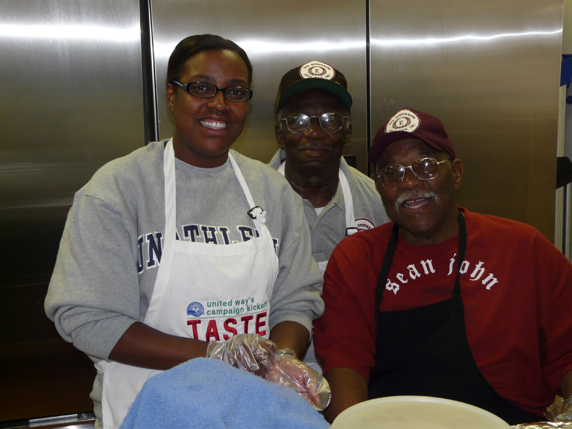 SEYMOUR JOHNSON AIR FORCE BASE, N.C. -- Staff Sgt. Veronica Jefferson (left) supports the Goldsboro community by preparing and serving lunch at the Community Soup Kitchen. Sgt. Jefferson was joined by fellow 916th Communication Squadron member Tech. Sgt. Maurice Carter and Senior Master Sgt. Les Roy Williams of the 4th Logistics Readiness Squadron. The volunteer opportunity was coordinated through the Air Force Sergeants Association by Tech. Sgts LaTasha Carroway. The Community Soup Kitchen of Goldsboro  reserves Wednesdays for volunteers from the AFSA.