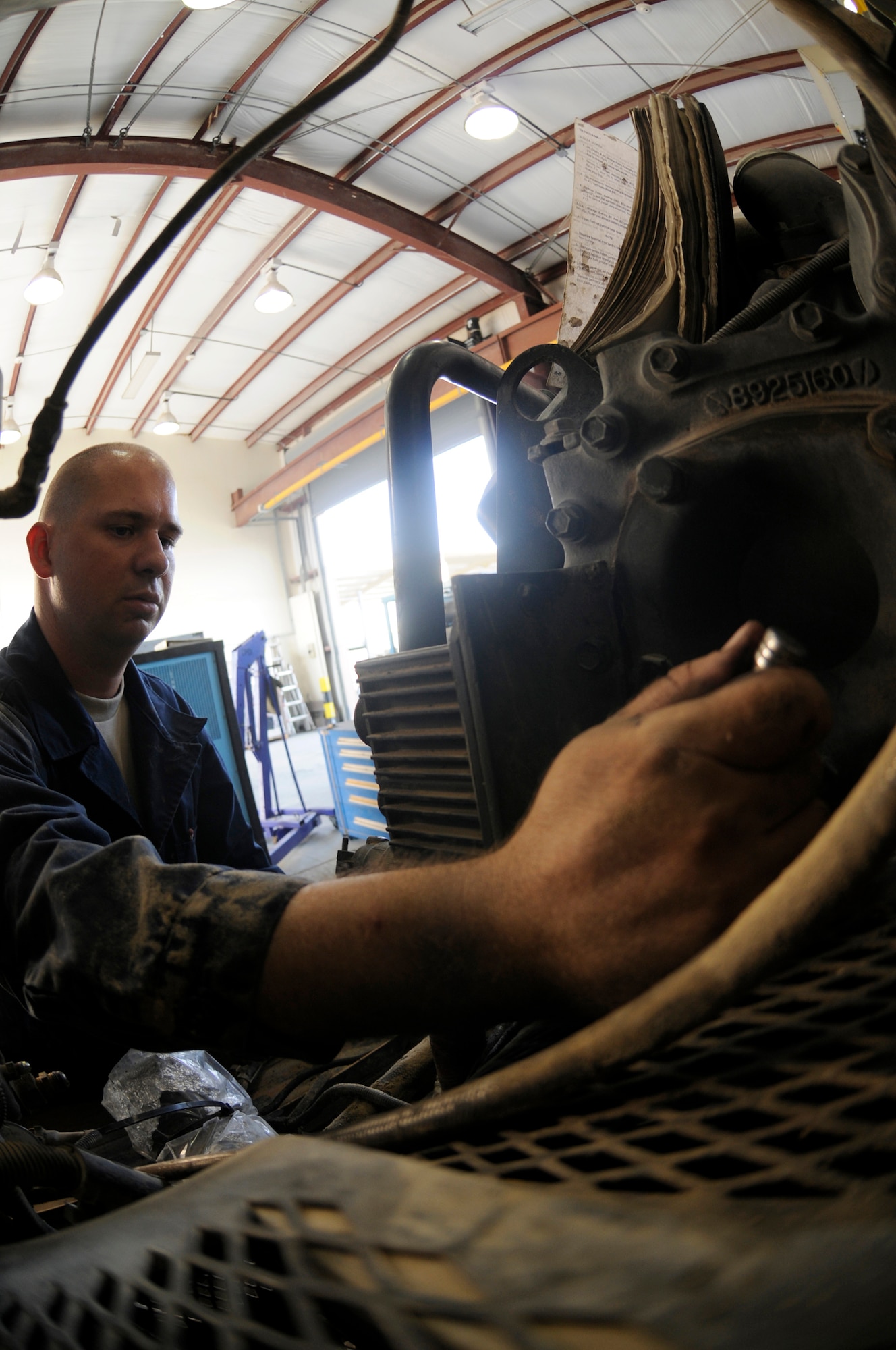 Staff Sgt. William Craddock, aerospace ground equipment craftsman assigned to the 379th Expeditionary Maintenance Squadron, installs a cannon plug assembly on a diesel-powered generator Oct. 30, at an undisclosed air base in Southwest Asia.  Sergeant Craddock, a native of Fairbanks, Alaska, is deployed from Ellsworth Air Force Base, S.D in support of Operations Iraqi and Enduring Freedom and Joint Task Force-Horn of Africa. (U.S. Air Force photo by Staff Sgt. Darnell T. Cannady/Released)