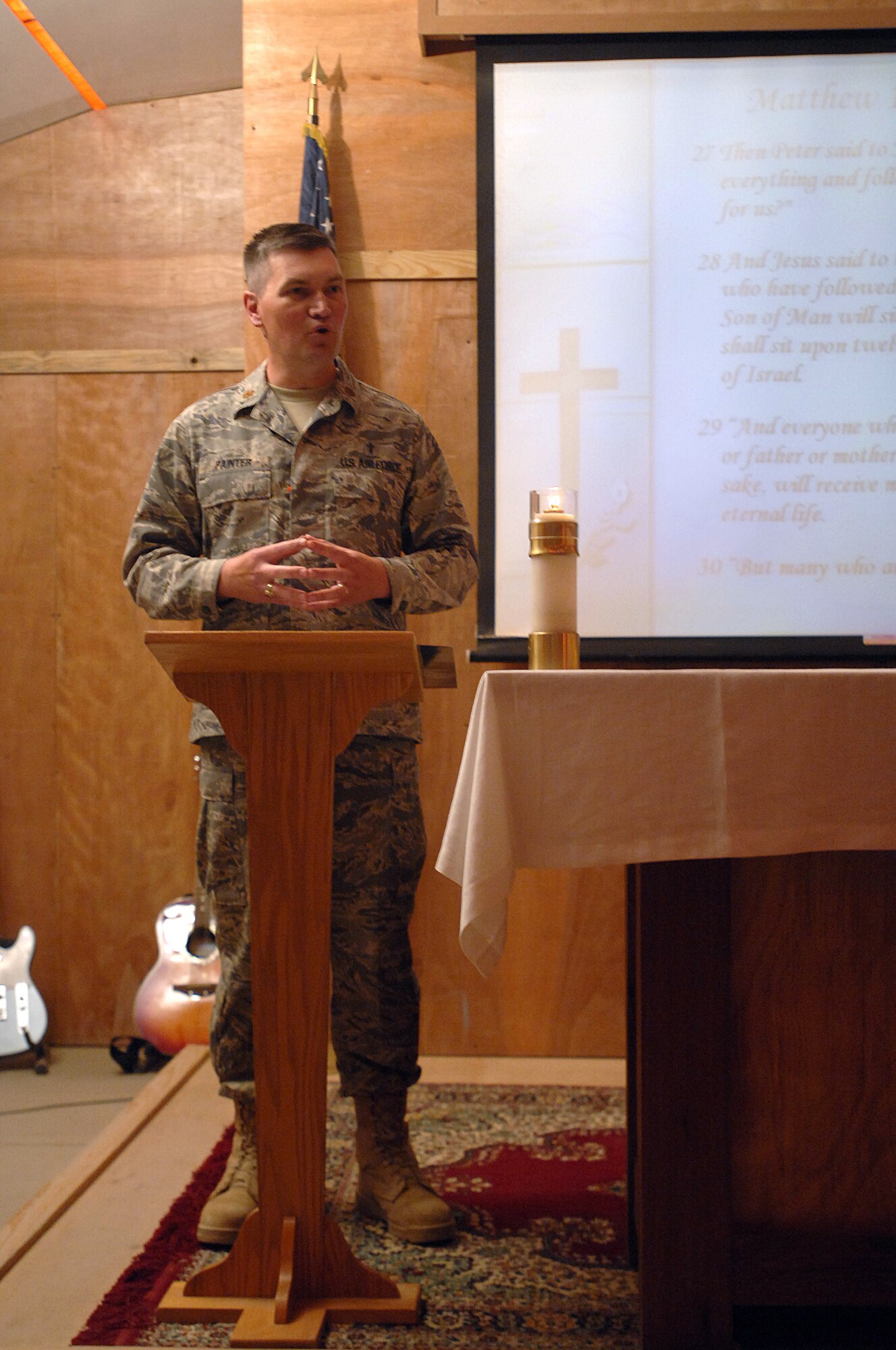Chaplain (Maj.) John Painter, 407th Air Expeditionary Group chaplain, leads a worship service held at the Oasis of Peace Chapel, Ali Air Base Iraq.  This service is attended by Air Force Personnel, multi-national force personnel and civilian personnel. Painter is a reservist deployed from Charleston Air Force Base, S.C. (U.S. Air Force photo/Tech. Sgt. Francesca Popp)