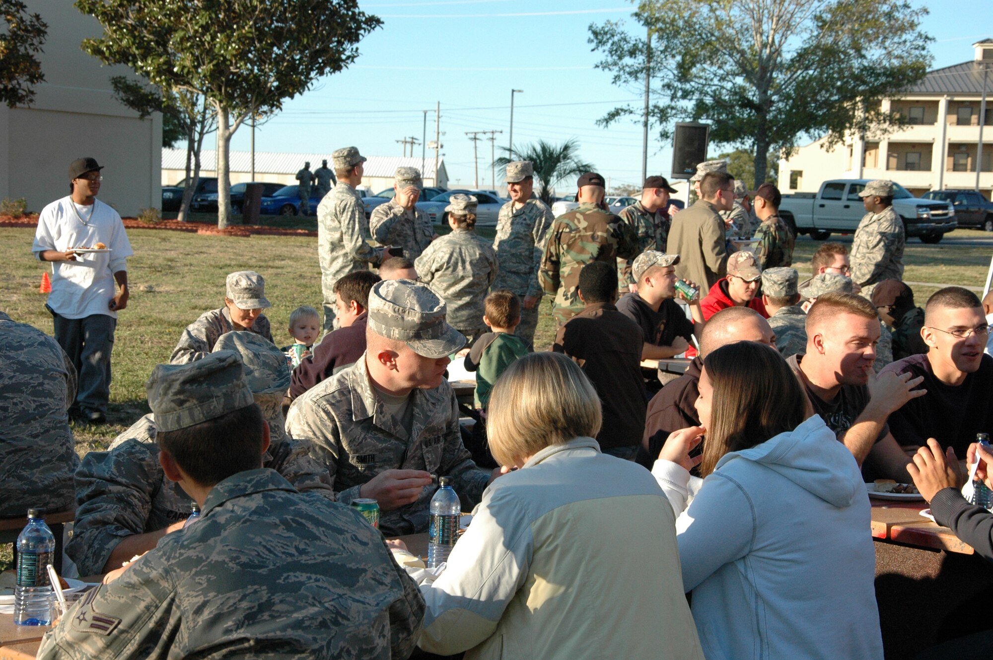 Dorm residents join in on the festivities at the ?Salute Our Troops? barbecue at the dorms on Eglin Air Force Base Oct. 29. The barbecue, provided by the Fort Walton Beach Chamber of Commerce, was held for Airmen living in the dorms in recognition of their service. (U.S. Air Force Photo/Jasmine DeNamur)