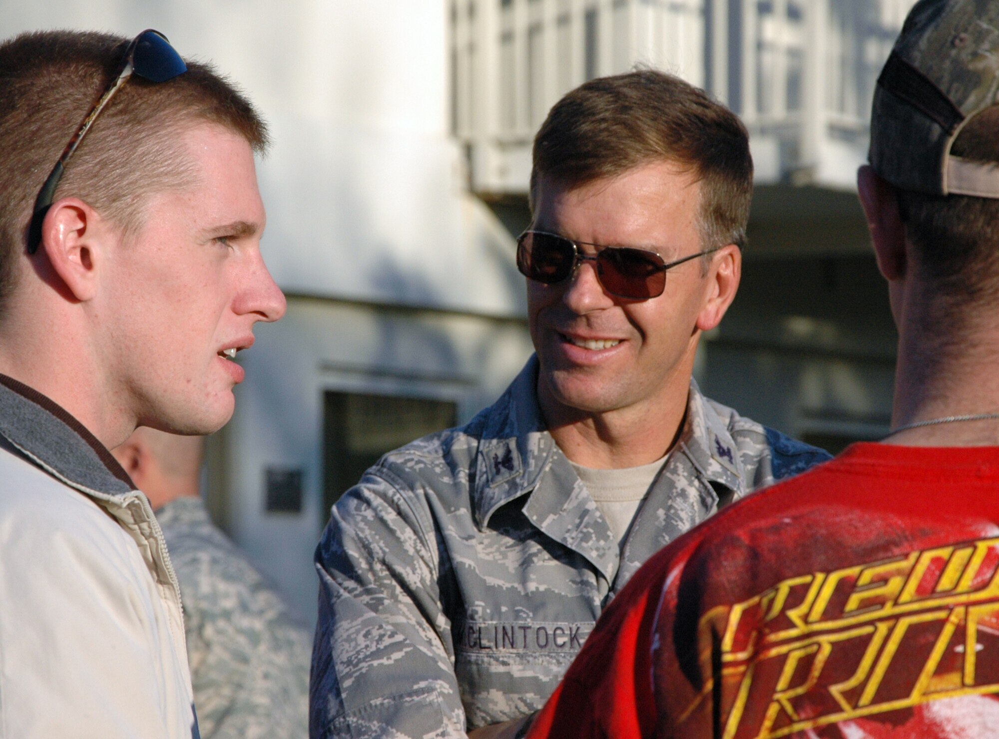 Col. Bruce McClintock, 96th Air Base Wing commander, speaks with dorm residents at the ?Salute Our Troops? barbecue at the dorms on Eglin Air Force Base Oct. 29. The barbecue, provided by the Fort Walton Beach Chamber of Commerce, was held for Airmen living in the dorms in recognition of their service. (U.S. Air Force Photo/Jasmine DeNamur)