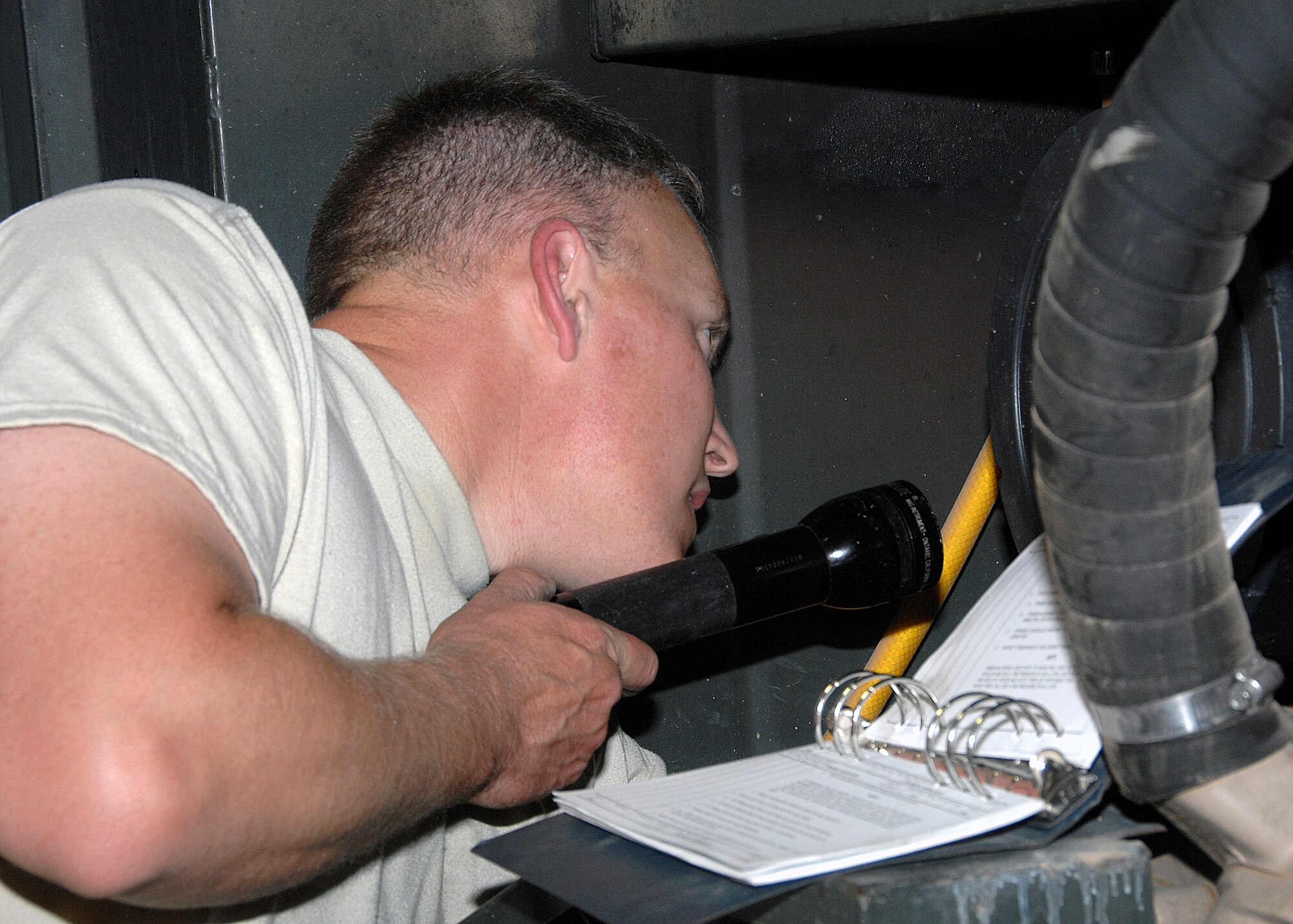 SOUTHWEST ASIA -- Tech. Sgt. Paul Slattery, 386th Expeditionary Maintenance Squadron Aerospace Ground Equipment flight, inspects an MA-3D portable air conditioning unit on Oct. 28 at an air base in Southwest Asia. The AGE flight provides direct ground support for C-130 aircraft, C-17 aircraft and various transient airframes. They also perform scheduled inspections and countless unscheduled maintenance actions on their fleet of more than 200 powered and non-powered pieces of equipment. (U.S. Air Force photo/Tech. Sgt. Raheem Moore)