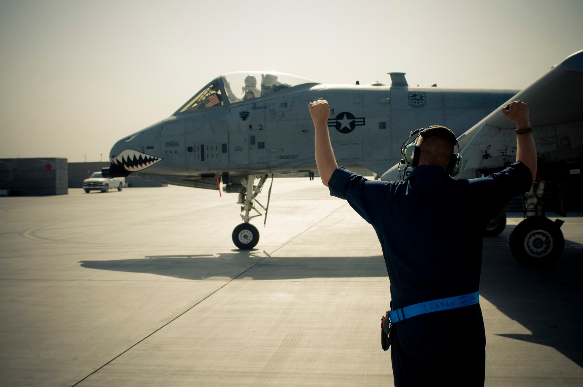 Senior Airman Benjamin Connery, 455th Expeditionary Aircraft Maintenance Squadron A-10 crewchief, cheers on the pilot of his A-10 Thunderbolt II at Bagram Air Field, Afghanistan, Oct. 18. "Putting a jet in the air gives me a great feeling of accomplishment -- especially in a deployed environment," said Airman Connery. He is deployed from the 23rd Aircraft Maintenance Squadron, Moody Air Force Base, Ga., and hails from Cashmere, Wash. (U.S. Air Force photo by Staff Sgt. Samuel Morse/Released)