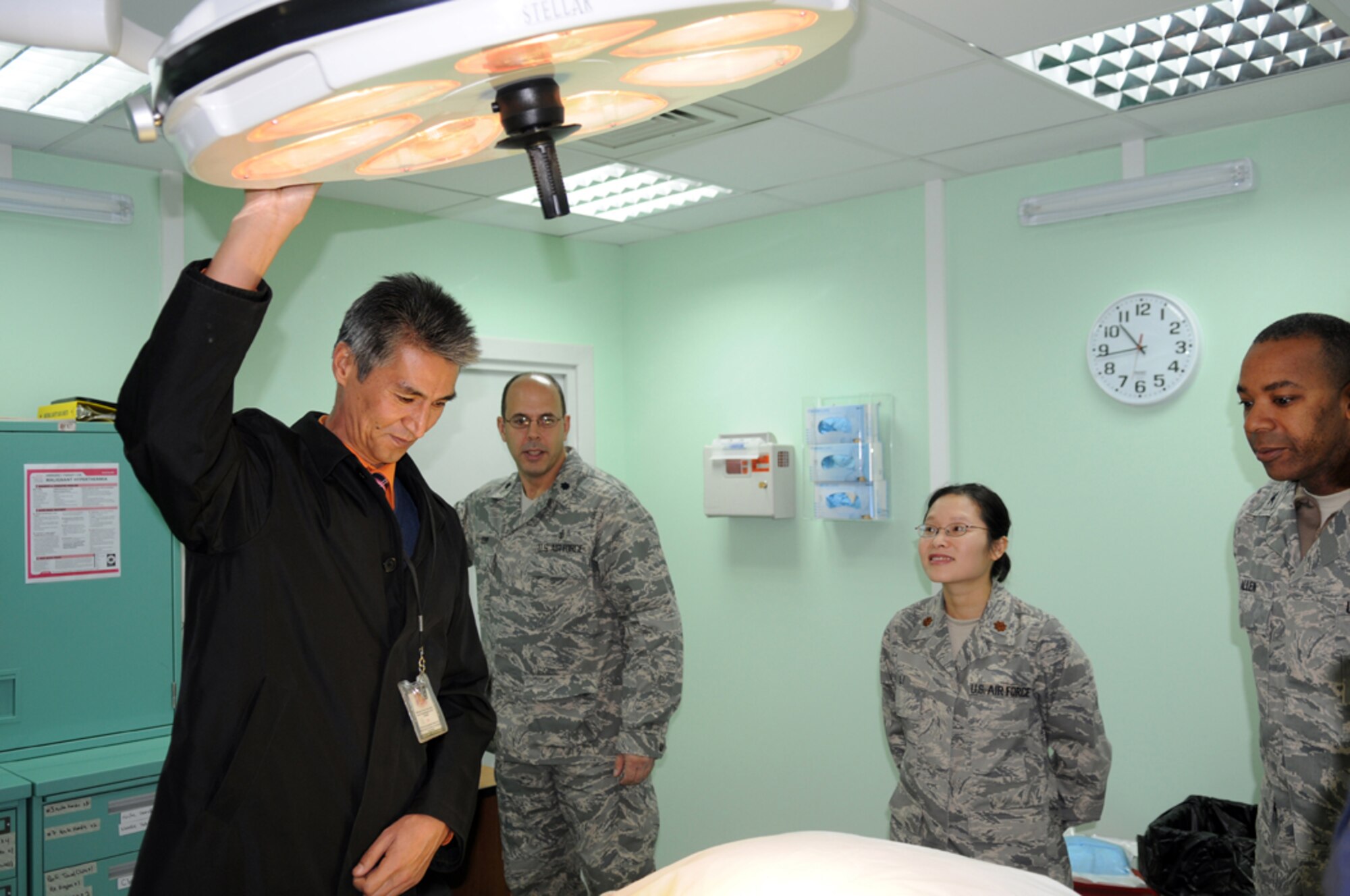 MANAS AIR BASE, KYRGYZSTAN --  Dr. Samudin Shabyraliev examines the operating room here, Oct. 25. The Bishkek Institute of Cardiac Surgery and Organ Transplant surgeon was invited for his first visit to the base to meet with wing leadership and tour the new medical facility. (Air Force photo / Senior Airman Ruth Holcomb) 