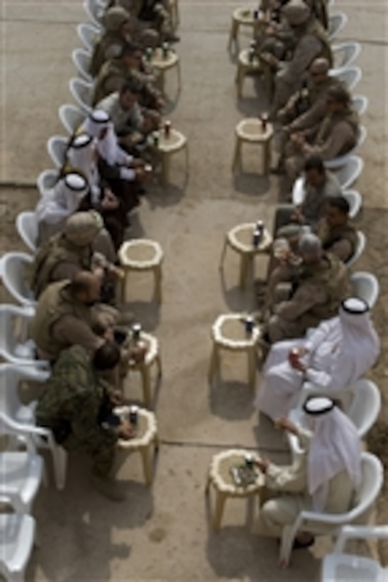 U.S. Marines and Iraqi officials meet to discuss future plans at the United Karmah Water Treatment Facility in Karmah, Iraq, on Oct. 22, 2008.  The Marines are from 1st Battalion, 3rd Marine Regiment, Regimental Combat Team 1.  