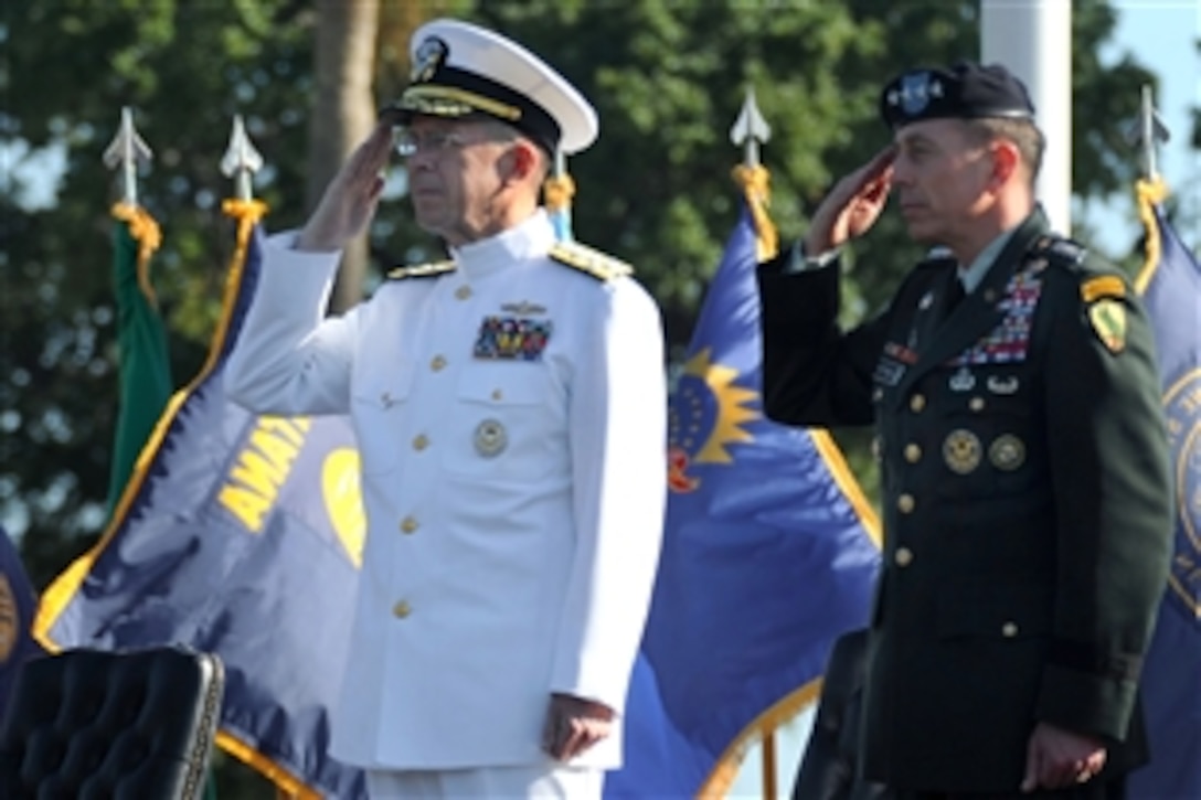 U.S. Army Gen. David H. Petraeus, right, and U.S. Navy Admiral Mike Mullen, chairman of the Joint Chiefs of Staff, salute the colors during the playing of the national anthem at the U.S. Central Command Change of Command ceremony on MacDill Air Force Base, Fla., Oct. 31, 2008.  Petraeus assumed command of CENTCOM from U.S. Army Lt. Gen. Martin E. Dempsey.


