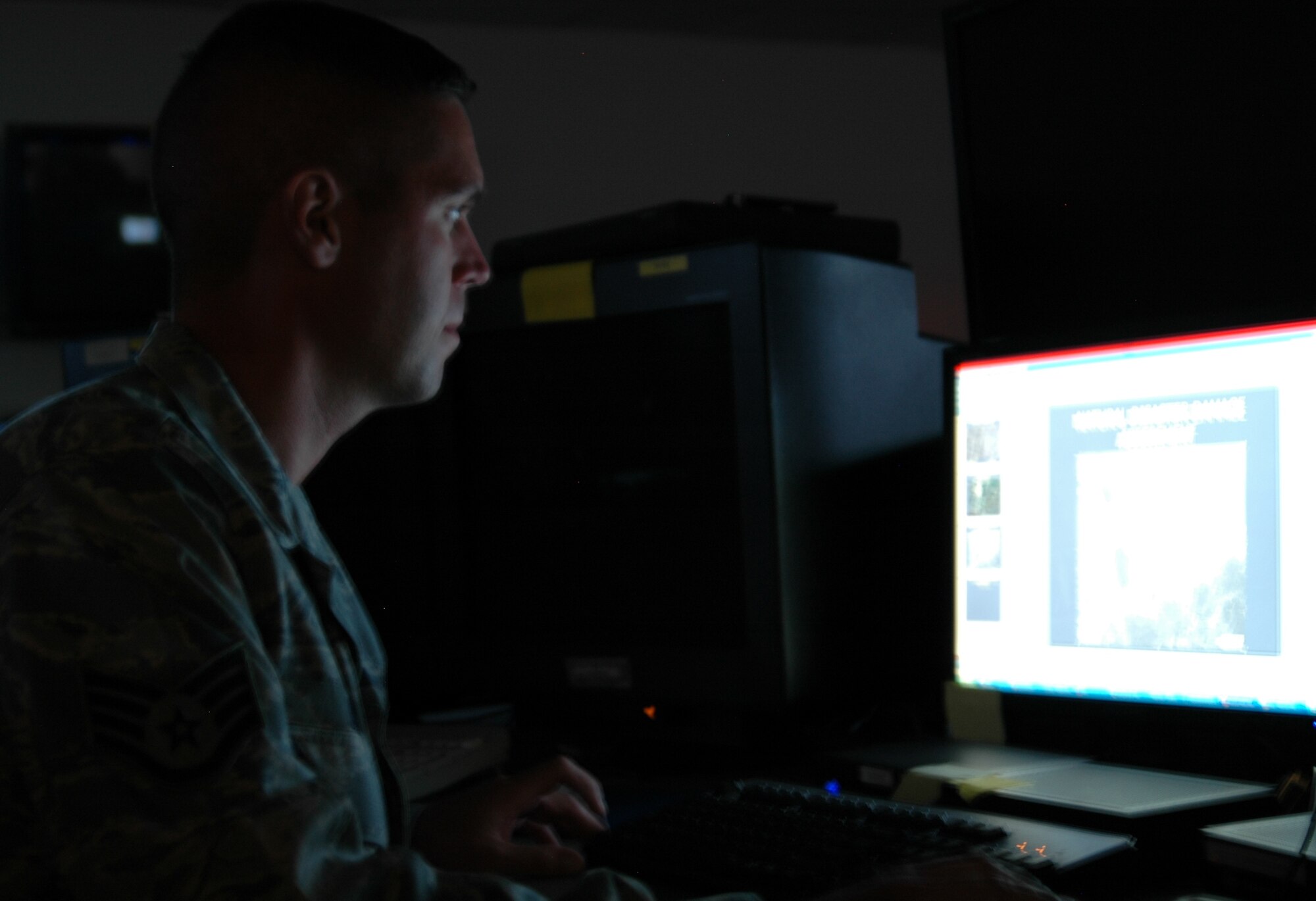 Staff Sgt. Joshua Orr, 30th Intelligence Squadron Imagery Analyst, Langley Air Force Base, reviews previous battle damage assessments from Hurricane Katrina between contingency taskings from Central Command. The 9th Reconnaissance Wing is shifting their CENTCOM taskings to the 30th IS so they can assist with Hurricane Gustav. (U.S. Air Force photo/Master Sgt. Steve Goetsch) 