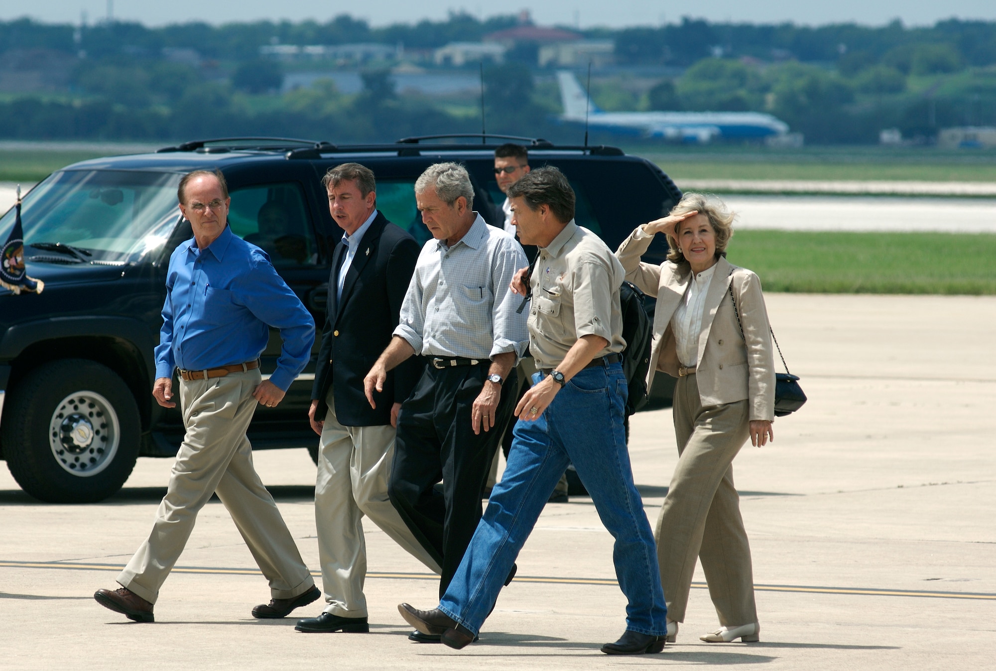 President George W. Bush (center) walks with Texas Gov. Rick Perry (right) and Texas Sen. Kay Bailey Hutchison, (far right) as they exit Air Force One Sept. 1 at Lackland Air Force Base, Texas. The president visited San Antonio to be briefed on evacuation processes in response to Hurricane Gustav and to personally thank the Airmen responsible for the successful relief efforts. (U.S. Air Force photo/Staff Sgt. Bennie J. Davis III) 