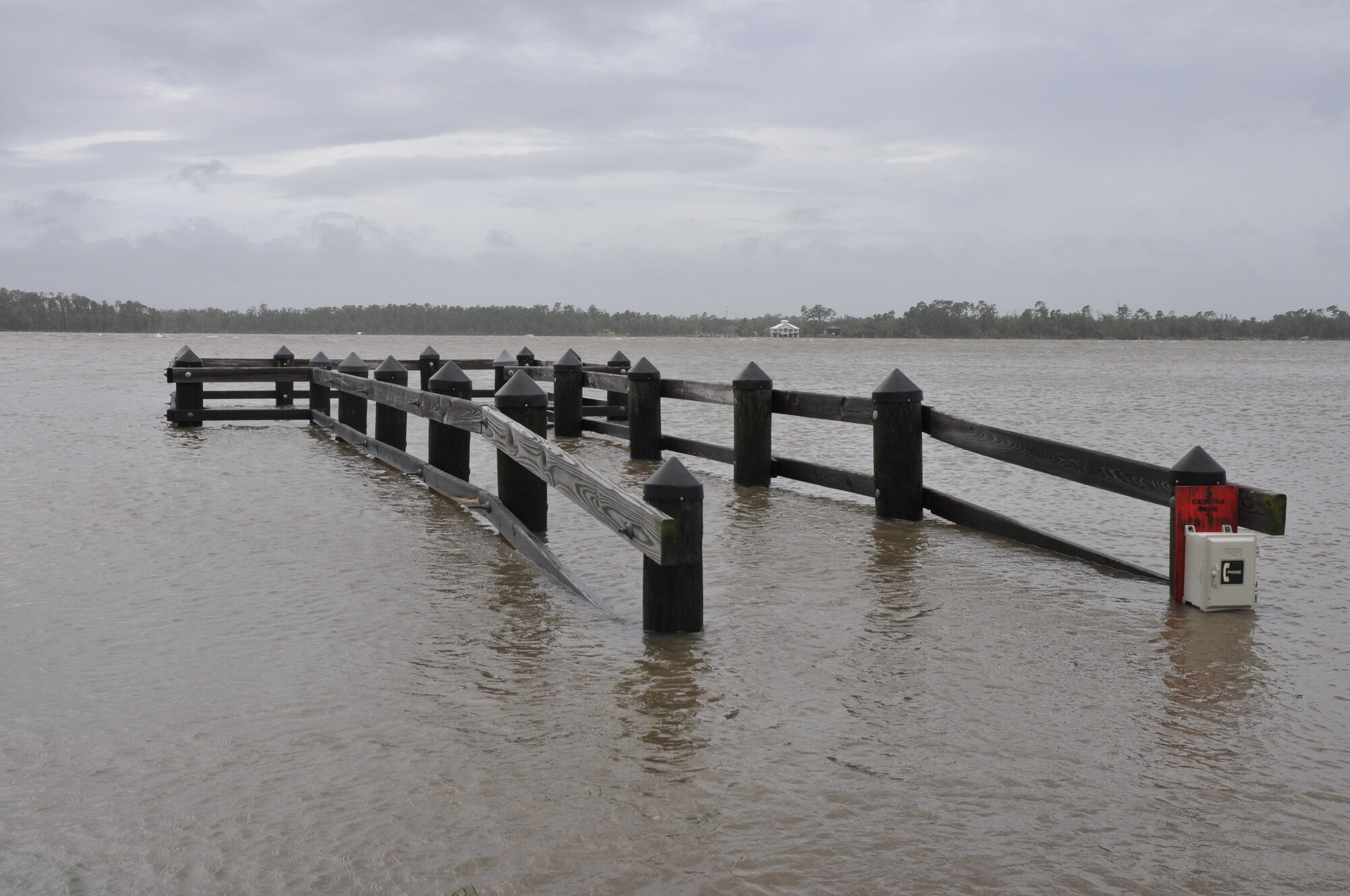 A fishing pier at the end of Keesler's runway almost completely underwater during Hurricane Gustav.  The water began to subside within hours (U.S. Air Force photo by Adam Bond).