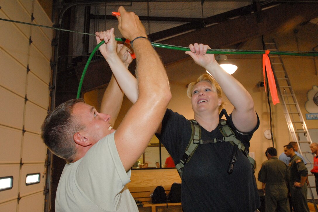 Air force Technical Sergeant Lori Gonser and Senior Airmen William Stephan from the 136 Airlift Wing, Texas Air National Guard prepare by setting up oxygen supply lines for special needs people at the SE Texas Regional Airport, Beaumont , Texas, in support of Hurricane Gustav Relief efforts, 30 August 2008. (Photo by TSgt Charles Hatton) 