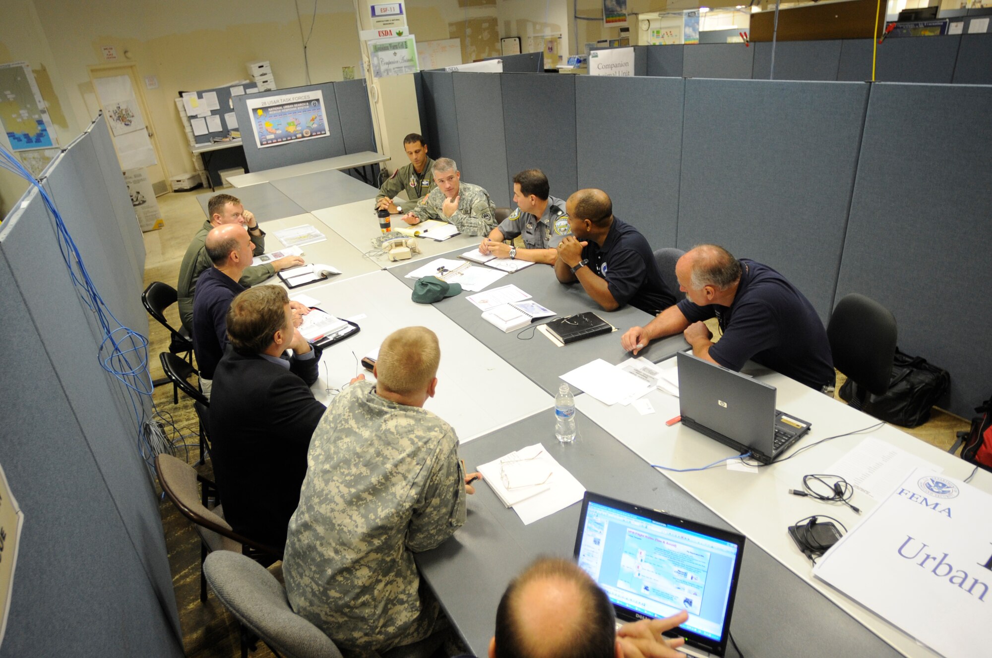 Officials with the Federal Emergency Management Agency, the Department of Defense and the Urban Search and Rescue Team discuss Hurricane Gustav's relief operations Sept. 1 at the Hurricane Gustav Joint Field Office in Baton Rouge, La.  (U.S. Air Force photo/Staff Sgt. Shawn Weismiller)