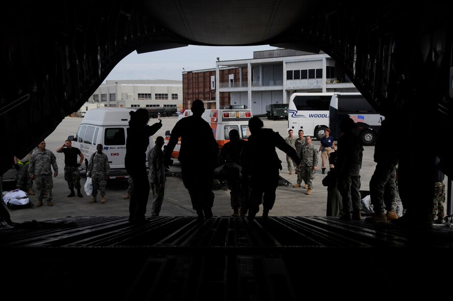 U.S. Army Soldiers and emergency personnel help an evacuee of Hurricane Gustav board a C-17 Globemaster III at Lake Front Airport, New Orleans, La., Aug. 31. The Federal Emergency Management Agency and the Department of Defense chartered flights to transport citizens to destinations safely outside the hurricane's path.  (U.S. Air Force photo by Staff Sgt. Shawn Weismiller)