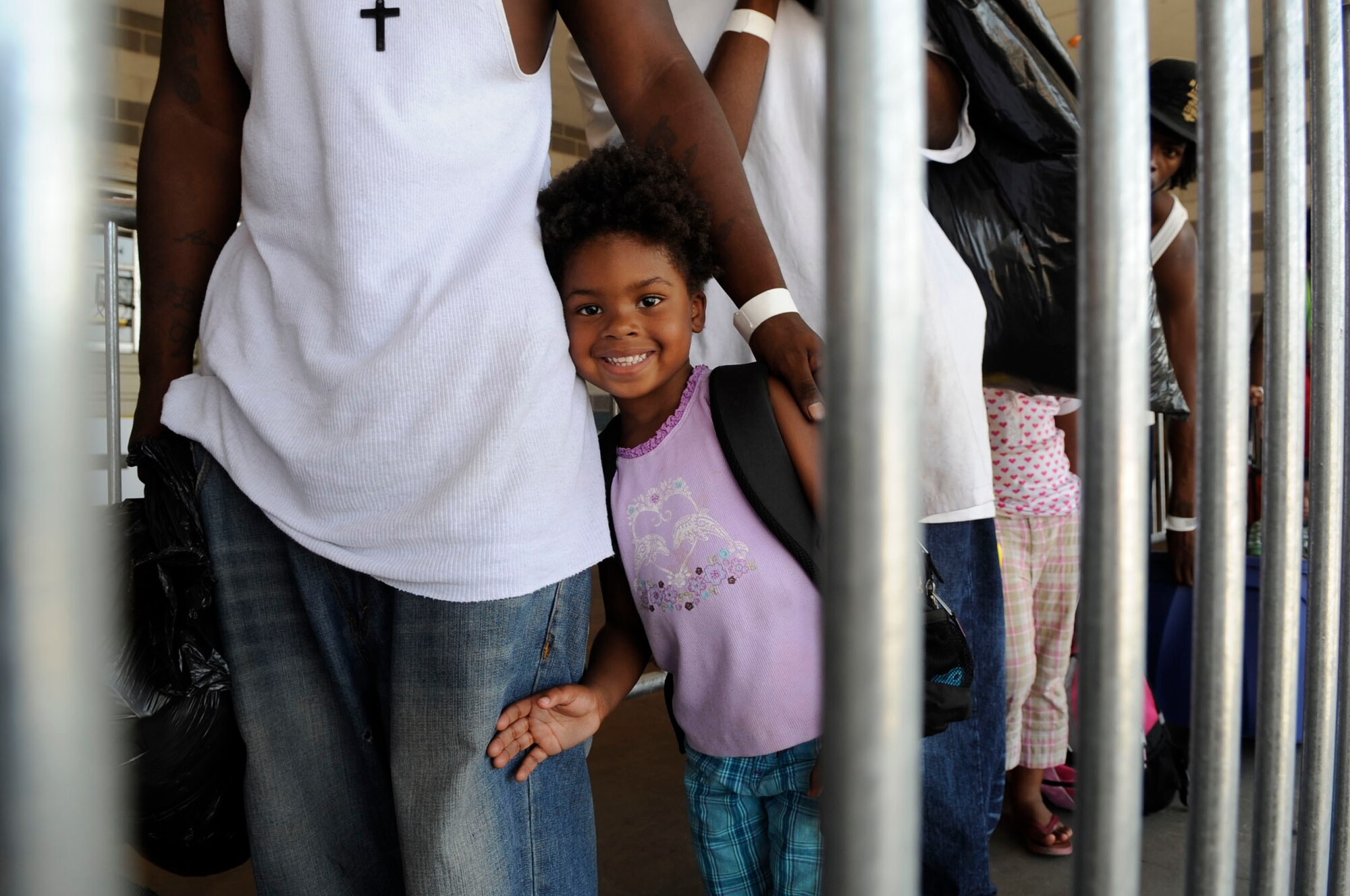 Arkel Greyhouse and other evacuees of Hurricane Gustav arrive at the Louis Armstrong International Airport, New Orleans, to board flights The Federal Emergency Management Agency and The Department of Defense have provided to transport citizens who otherwise could not leave on their own to destinations safely outside the hurricanes path, Aug. 30. (U.S. Air Force photo/Staff Sgt. Shawn Weismiller)