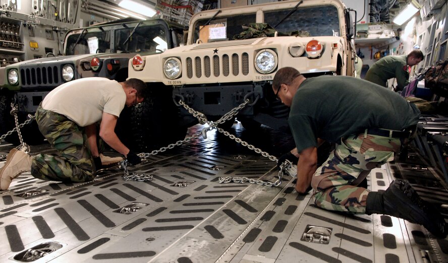 Members of MacDill Air Force Base, Fla. ground crew secure Humvees on a C-17 Globemaster. The vehicles and medical supplies were sent to Beaumont, Texas, in support of evacuations prior to Hurricane Gustav's arrival. (U.S. Air Force photo/Staff Sgt. Joseph Swaff)