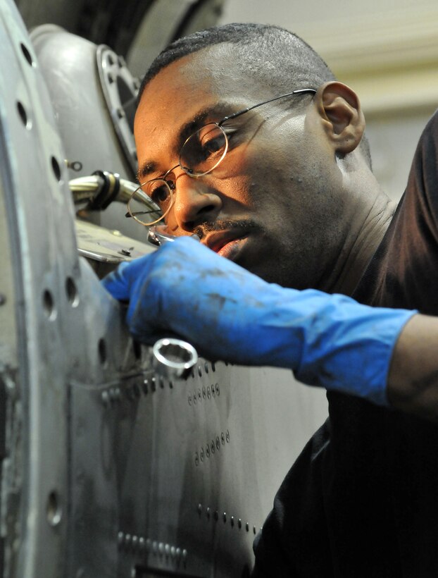Air force SSgt Pat Watson works to repair the engine of a C-130, on Jan. 24, 2008 at Naval Air Station Joint Reserve Base, Carswell Field, Fort Worth, TX.  SSgt Watson, a memeber of the 136th Maintence Squadron, Texas Air National Guard strives to maintain the outstanding safety record and mission capability of the 136th Airlift Wing.  (U.S. Air Force photo/ TSgt Craig Lifton) (released) 