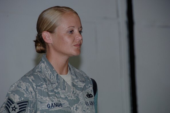 SOUTHWEST ASIA -- Staff Sgt. Virginia Ganus from the 380th Expeditionary Security Forces Squadron waits to be awarded the Air Force Combat Action Medal here Aug. 31. She recieved the medal for her actions during a combat convoy near Kirkuk regional Air Base, Iraq. Sergeant Ganus is deployed from Pope Air Force Base, N.C. Her hometown is Roanoke, Va.(U.S. Air Force photo/Tech. Sgt. Christopher A Campbell)(released)