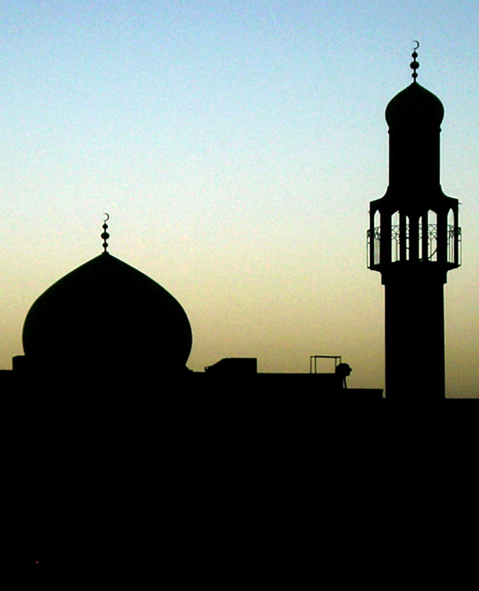 A mosque is silhouetted against the evening twilight near Balad, Iraq, May 29. Muslims will begin their Ramadan observance the evening of Sept. 1. The holiday marks the month that the Prophet Muhammed received the Qur'an from the archangel Gabriel and is observed through fasting throughout the day. (U.S. Army photo/Staff Sgt. Timothy Sander)