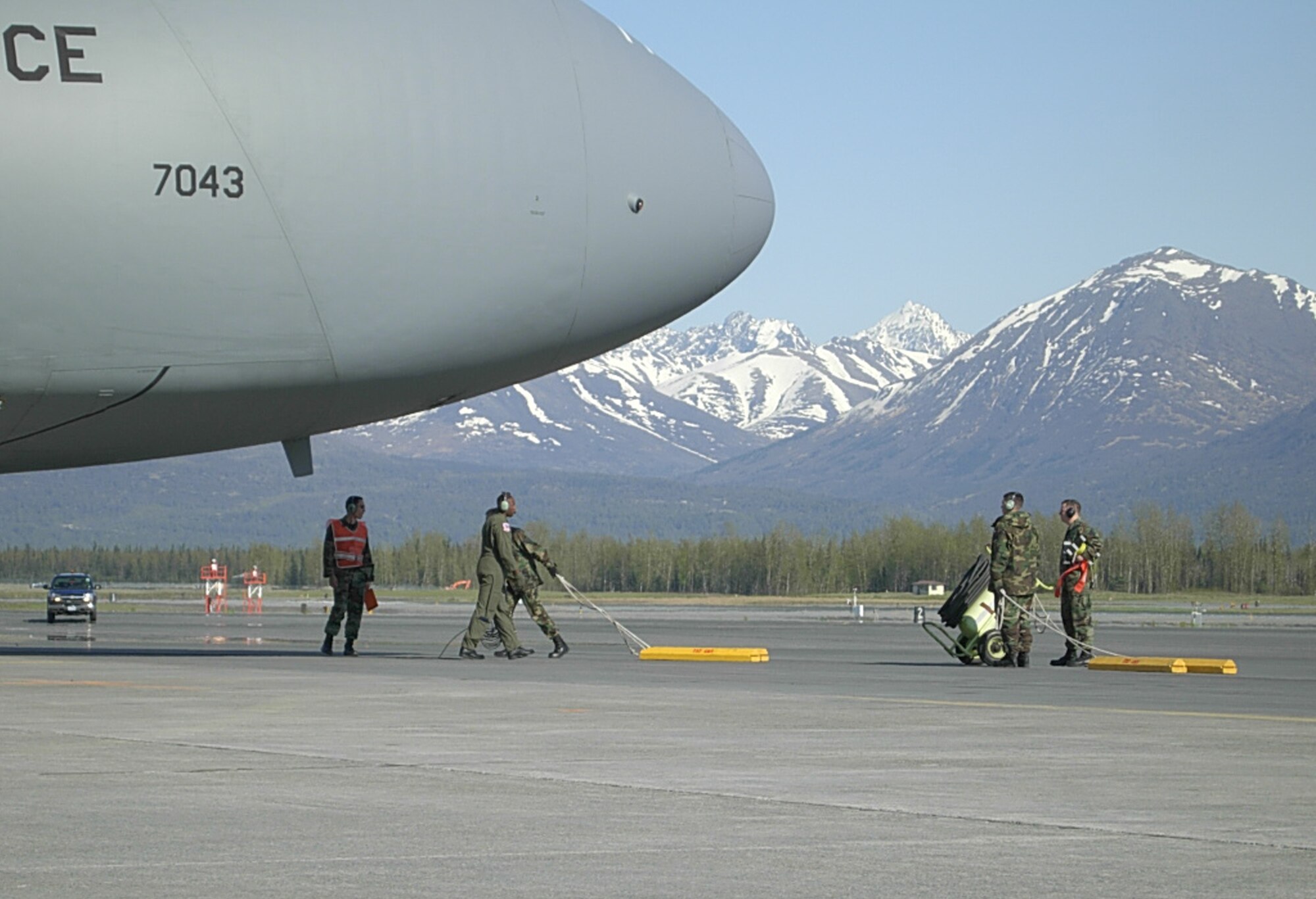 ELMENDORF AIR FORCE BASE, Alaska -- Members of the 732nd Air Mobility Squadron prepare a C-5 Galaxy for maintenance here. The 732nd AMS was awarded the maintenance effectiveness award for the unit's management of resources and its contributions to the mission. (U.S. Air Force photo)