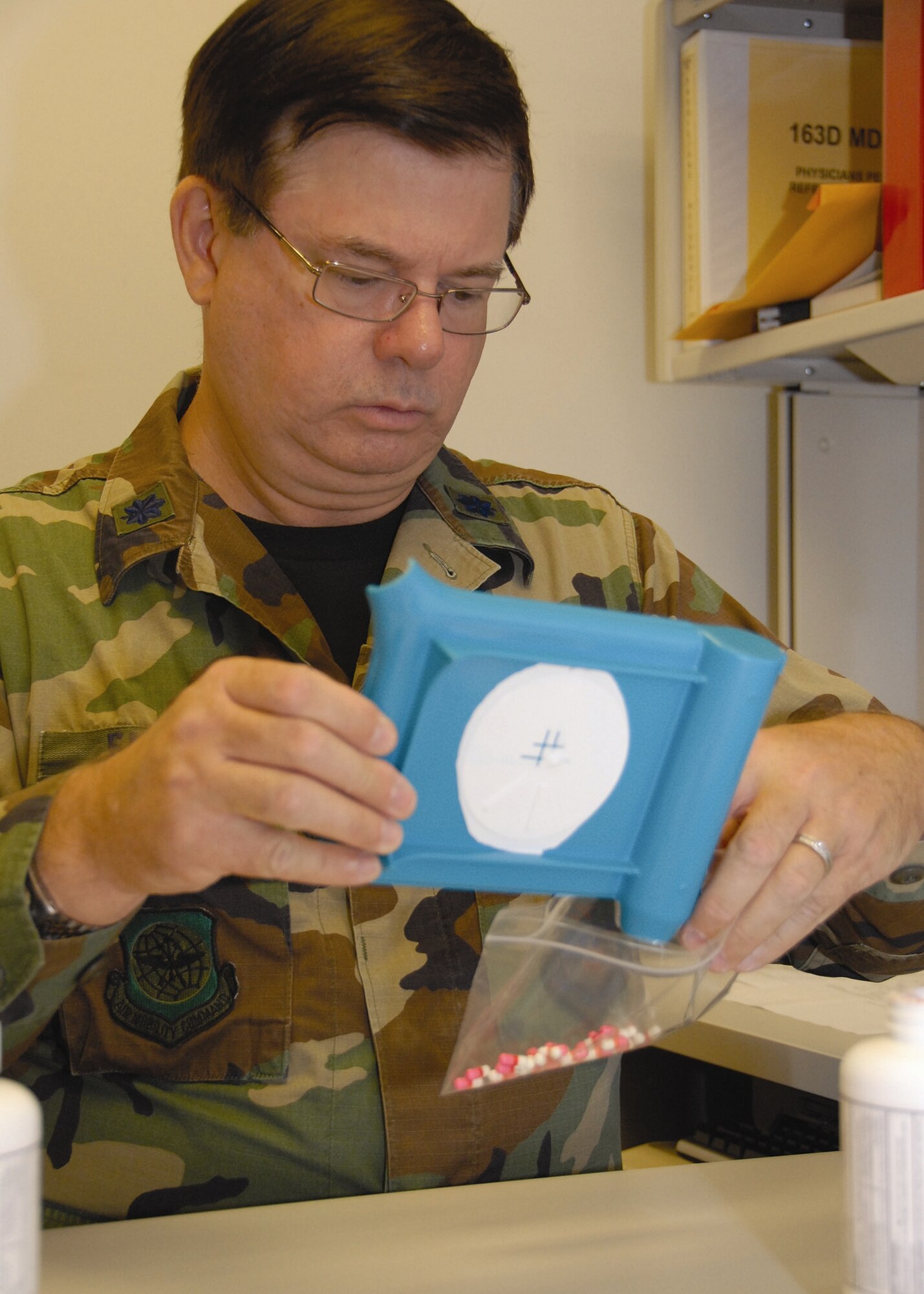 Lt. Col. David Emery, a 163d Medical Group physician assistant from March Air Reserve Base, counts pills in preparation for an Air Forces South-sponsored humanitarian mission to Guatemala known as a Medical Readiness Training Exercise. A team of 32 medical personnel will provide medical treatment, ranging from treating common cold symptoms to providing optometric, dental and pediatric care to Guatemalan citizens during a two-week visit from Aug. 16-30. (U.S. Air Force photo by Senior Airman Paul Duquette, 163rd RW)
