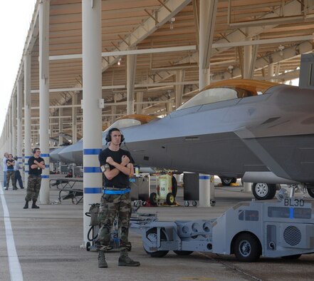 TYNDALL AIR FORCE BASE, Fla. -- 525th Aircraft Maintenance Unit crew chiefs prepare to launch F-22A Raptors here. Eight aircraft and about 140 maintenance personnel deployed to Tyndall for the Weapons System Evaluation Program Aug. 17-28. The deployment included members from the 3rd Wing and Reservists from the 477th Fighter Group. (U.S. Air Force photo/Capt. Torri White)