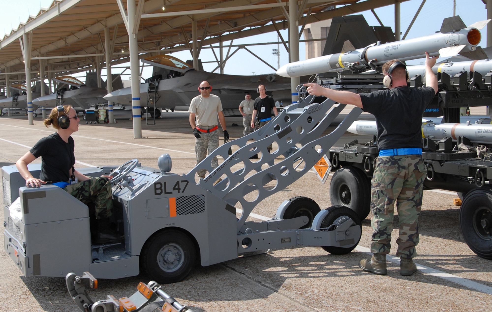 TYNDALL AIR FORCE BASE, Fla. -- 3rd Maintenance Group weapons loaders get hands-on experience with live munitions during the Weapons System Evaluation Program here Aug. 17-28. Eight aircraft and about 140 maintenance personnel deployed to Tyndall for the Weapons System Evaluation Program Aug. 17-28. The deployment included members from the 3rd Wing and Reservists from the 477th Fighter Group. (U.S. Air Force photo/Capt. Torri White)