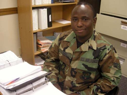 ANDREWS AIR FORCE BASE, Md. -- Airman 1st Class Kayode Lawal, 459th Mission Support Flight personnel relocations clerk, pauses during records review here Aug. 20, 2008. The Nigerian-born Airman obtained U.S. citizenship Aug. 6. (U.S. Air Force photo/Tech. Sgt. Amaani Lyle) 
