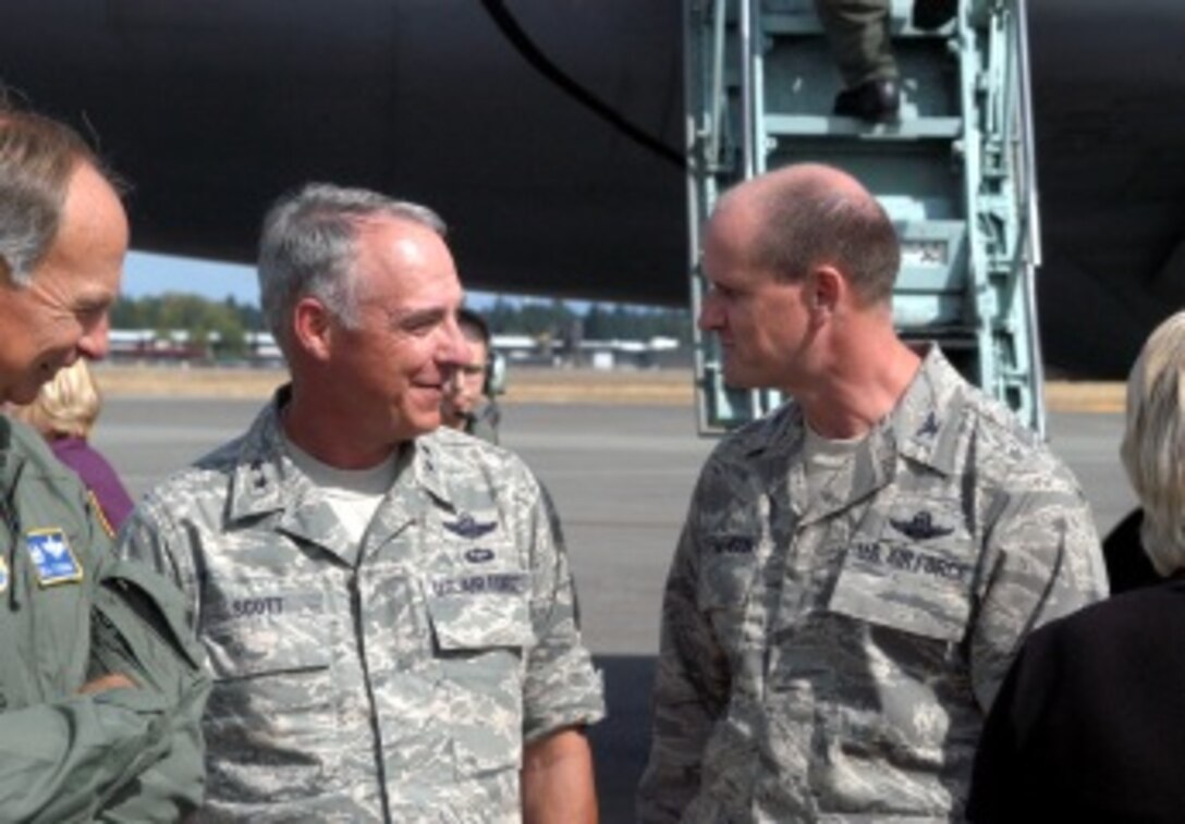 Maj. Gen. Winfield "Skip" Scott III, 18th Air Force commander, talks with Col. Jeffrey Stephenson, 62nd Airlift Wing commander, after arriving at McChord Aug. 26. The 18th AF commander and former Team McChord member returned for a visit to the Great Northwest Aug. 26-28. (U.S. Air Force photo/Randy White)