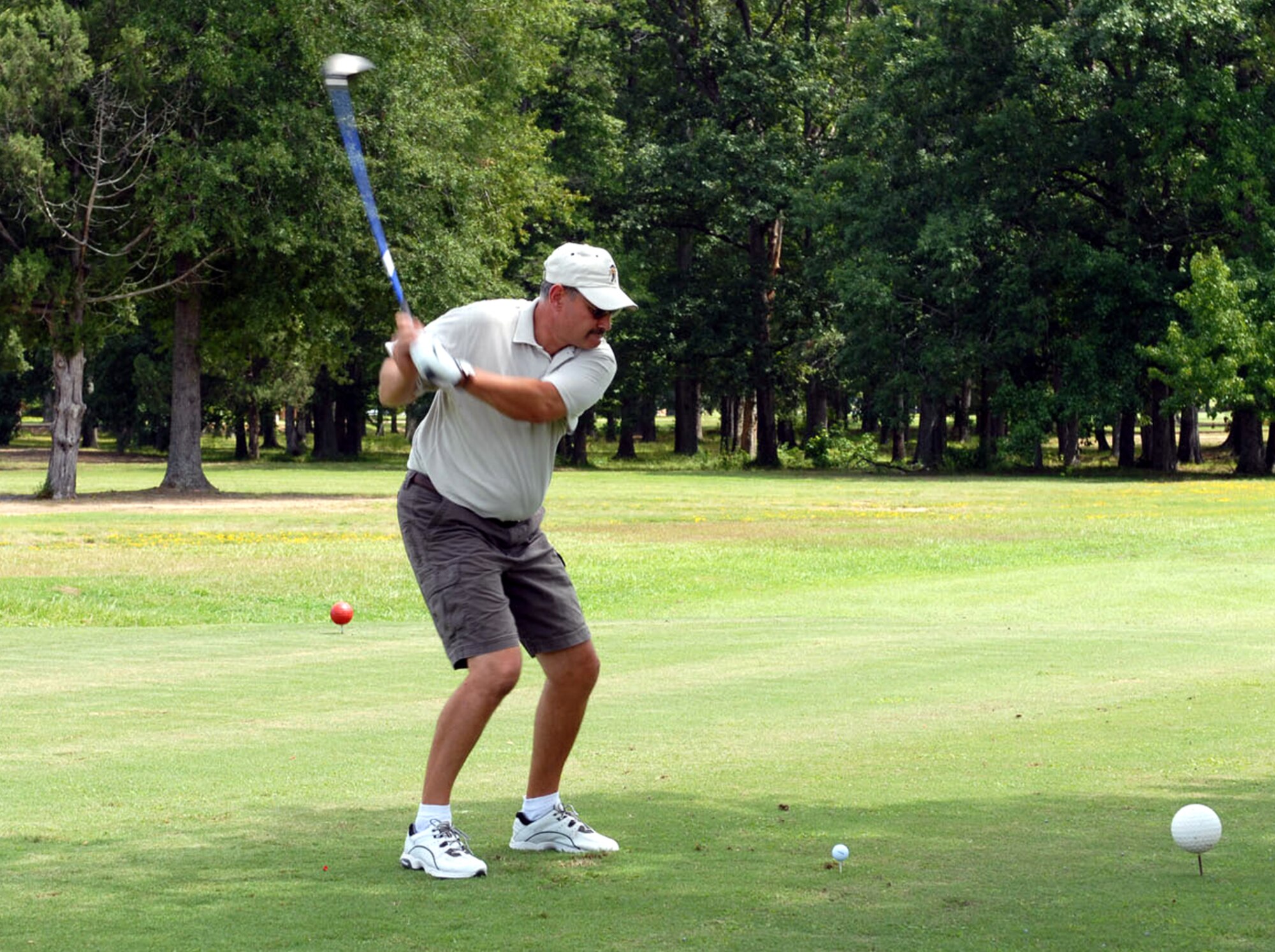 Randy Bailey, 14th Logistics Readiness Division, tees off at the Air Force Ball Fundraiser Golf Tournament held at Whispering Pines Friday. Bailey and teammates Roger Hinshaw, Julian McCrary and Mary Ann Shows won first place honors in the tournament. (U.S. Air Force photo by Elizabeth Owens)