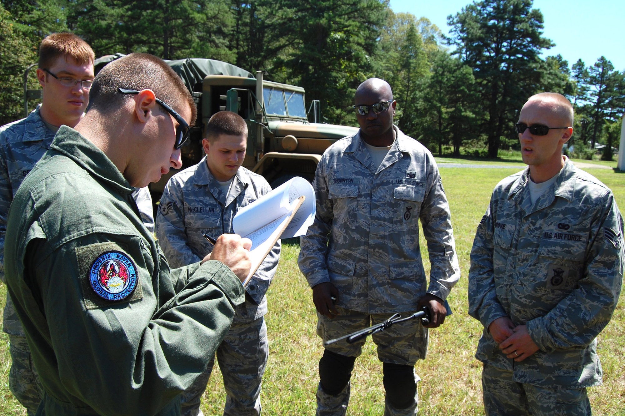 Staff Sgt. James Chubb, an instructor in the U.S. Air Force Expeditionary Center's Phoenix Raven Training Course, provides feedback to students during an evaluation session for the Raven course on a Fort Dix, N.J., range Aug. 20, 2008.  Raven training is taught by the Center's 421st Combat Training Squadron at Fort Dix.  It gives security forces Airmen specialized training in aircraft security, verbal judo and self defense.  (U.S. Air Force Photo/Tech. Sgt. Scott T. Sturkol)