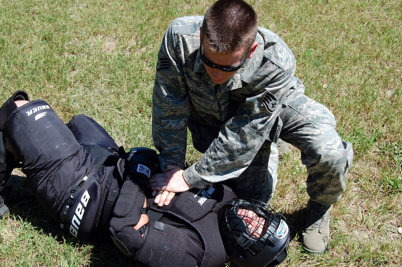A student in the U.S. Air Force Expeditionary Center's Phoenix Raven Training Course checks on the status of a downed "agressor" during an evaluation session for the Raven course on a Fort Dix, N.J., range Aug. 20, 2008.  Raven training is taught by the Center's 421st Combat Training Squadron at Fort Dix.  It gives security forces Airmen specialized training in aircraft security, verbal judo and self defense.  (U.S. Air Force Photo/Tech. Sgt. Scott T. Sturkol)
