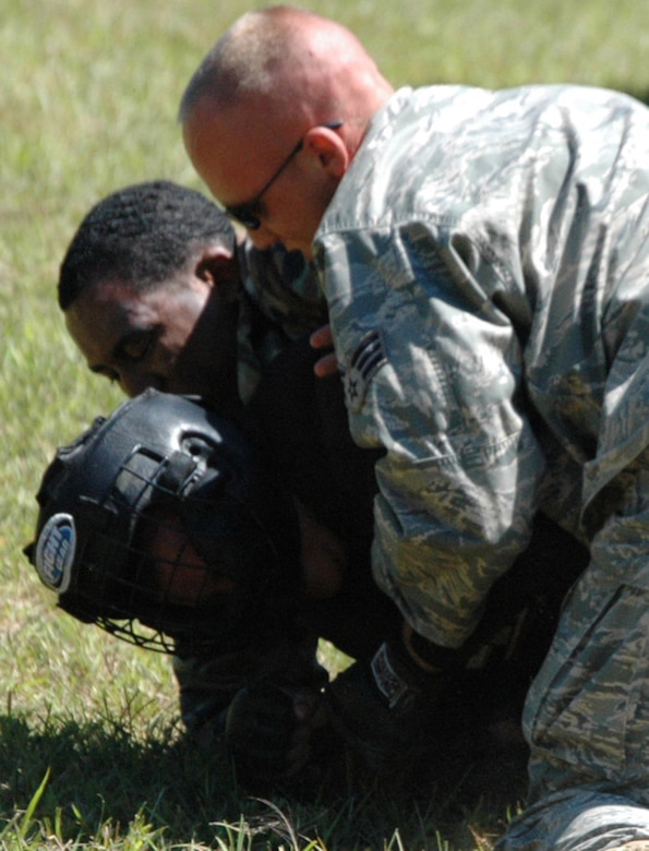 Students in the Air Force Phoenix Raven Training Course subdue an "aggressor" during an evaluation session in the course on a Fort Dix, N.J., range Aug. 20, 2008.  The course, taught by the U.S. Air Force Expeditionary Center's 421st Combat Training Squadron on Fort Dix, trains security forces Airmen to become Ravens where they specialize in protecting Air Force aircraft in austere environments.  (U.S. Air Force Photo/Tech. Sgt. Scott T. Sturkol)