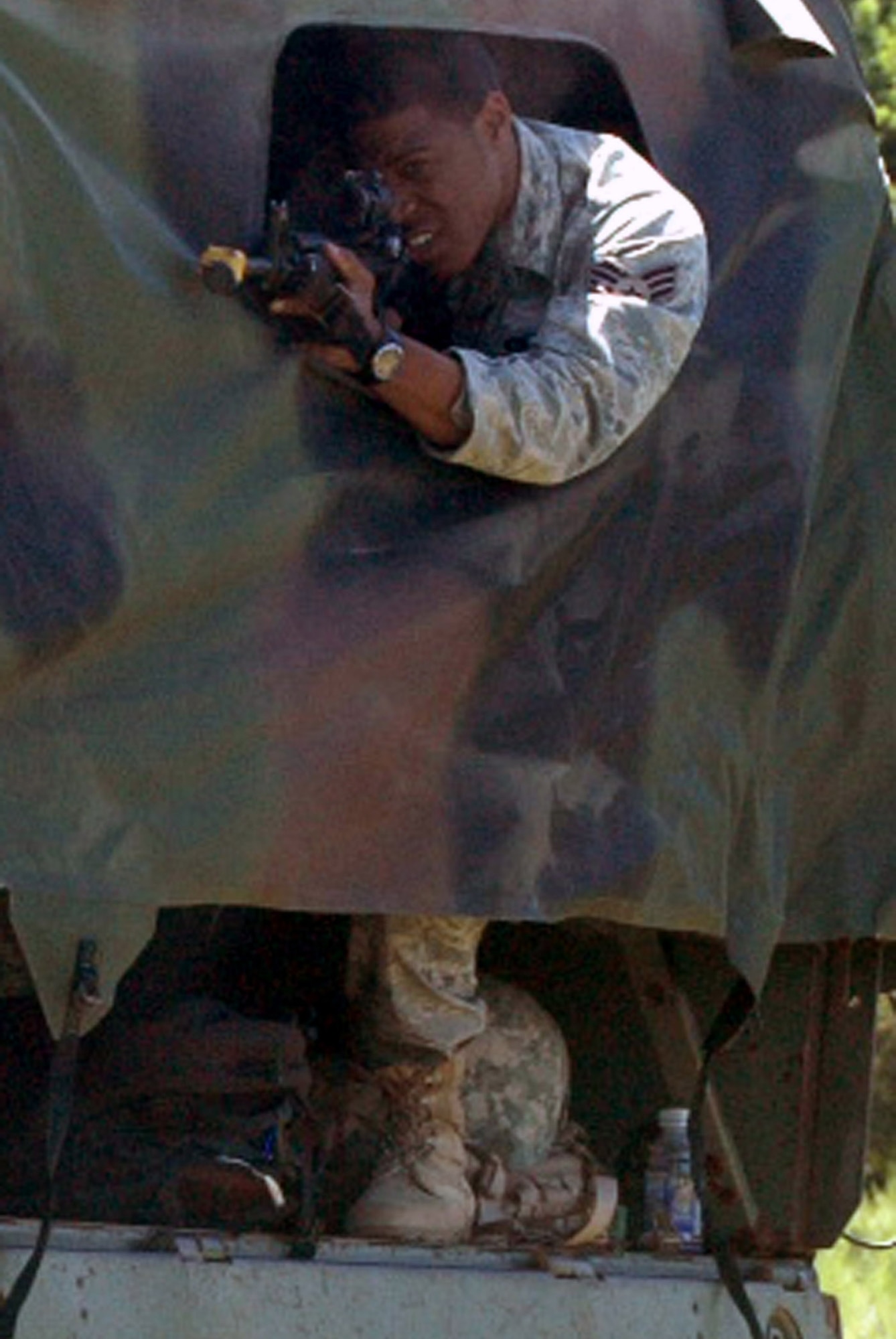 A student in the Air Force Phoenix Raven Course fires back at an "aggressor" during an evaluation session in the course on a Fort Dix, N.J., range Aug. 20, 2008.  The course, taught by the U.S. Air Force Expeditionary Center's 421st Combat Training Squadron, trains security forces Airmen to become Ravens where they specialize in protecting Air Force aircraft in austere environments.  (U.S. Air Force Photo/Tech. Sgt. Scott T. Sturkol)