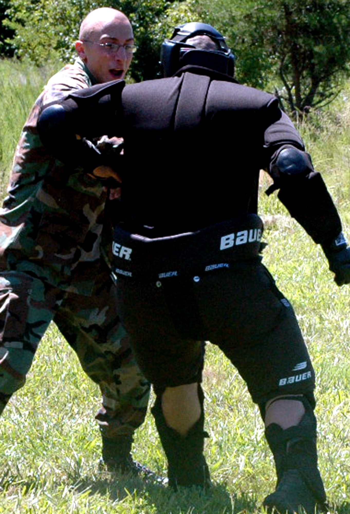 Airman 1st Class Antonio D'Errico, from the 436th Security Forces Squadron, Dover Air Force Base, Del., and a student in the Air Force Phoenix Raven Course, battles an "aggressor" during an evaluation session in the course on a Fort Dix, N.J., range Aug. 20, 2008.  The course, taught by the U.S. Air Force Expeditionary Center's 421st Combat Training Squadron, trains security forces Airmen to become Ravens where they specialize in protecting Air Force aircraft in austere environments.  (U.S. Air Force Photo/Tech. Sgt. Scott T. Sturkol)