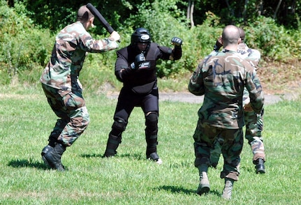 Students in the Air Force Phoenix Raven Course, fight back an "attacker" during an evaluation session in the course on a Fort Dix, N.J., range Aug. 20, 2008.  The course, taught by the U.S. Air Force Expeditionary Center's 421st Combat Training Squadron, trains security forces Airmen to become Ravens where they specialize in protecting Air Force aircraft in austere environments.  (U.S. Air Force Photo/Tech. Sgt. Scott T. Sturkol)