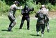 Students in the Air Force Phoenix Raven Course, fight back an "attacker" during an evaluation session in the course on a Fort Dix, N.J., range Aug. 20, 2008.  The course, taught by the U.S. Air Force Expeditionary Center's 421st Combat Training Squadron, trains security forces Airmen to become Ravens where they specialize in protecting Air Force aircraft in austere environments.  (U.S. Air Force Photo/Tech. Sgt. Scott T. Sturkol)