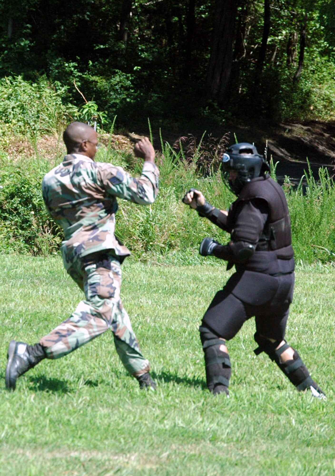 Staff Sgt. Michael Garner, from the 436th Security Forces Squadron, Dover Air Force Base, Del., and a student in the Air Force Phoenix Raven Course, fights back an "attacker" during an evaluation session in the course on a Fort Dix, N.J., range Aug. 20, 2008.  The course, taught by the U.S. Air Force Expeditionary Center's 421st Combat Training Squadron, trains security forces Airmen to become Ravens where they specialize in protecting Air Force aircraft in austere environments.  (U.S. Air Force Photo/Tech. Sgt. Scott T. Sturkol)