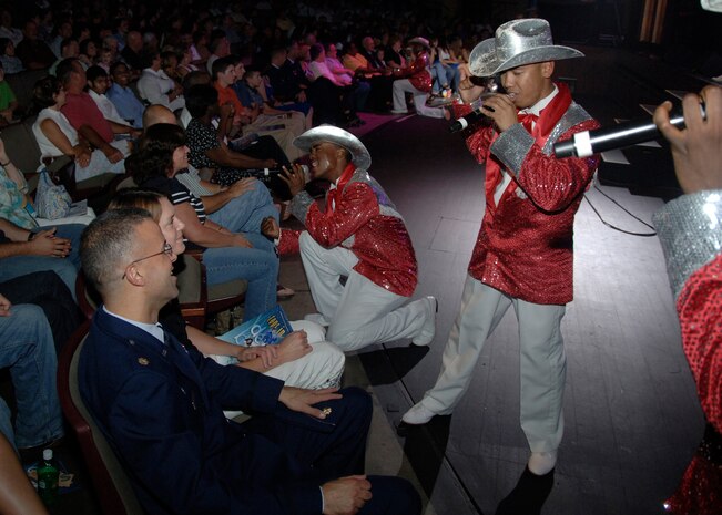 Tops in Blue vocalists serenade members of the audience during a performance at the Charleston Performing Arts Center Aug. 30. Each year, the Air Force selects 35 of the most talented men and women from its active-duty Airmen to form Tops in Blue. (U.S. Air Force photo/Airman 1st Class Timothy Taylor)