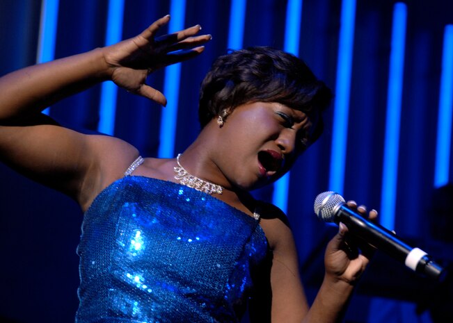 Airman 1st Class Alice Lewis sings as part of Tops in Blue at the Charleston Performing Arts Center Aug. 30. This year, Tops in Blue celebrates 55 years of entertainment history. Airman Lewis is a vocalist for Tops in Blue. (U.S. Air Force photo/Airman 1st Class Timothy Taylor)
