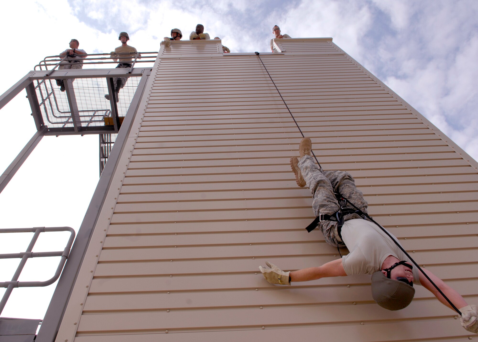 CANNON AIR FORCE BASE, N.M. -- Tech.Sgt. Gregory Neuberger, 27th Special Operations Security Forces Squadron, rappels Austrailian style during a security forces exercise Aug. 29. The tower, usually used by base firefighters, helped build team and individual confidence for security forces airmen. (U.S. Air Force photo/Airman 1st Class Evelyn Chavez)