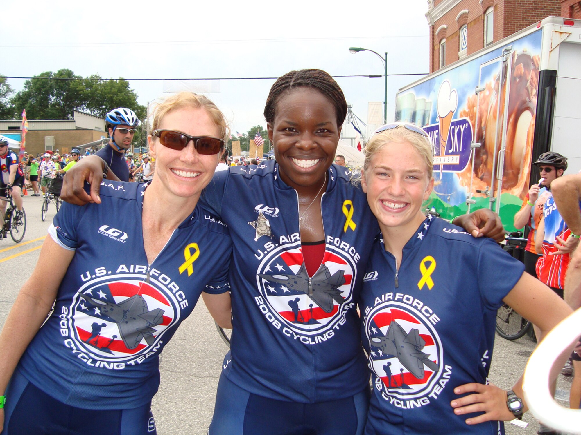 FROM LEFT: First Lt. Spring Clegg, Davis-Monthan Air Force Base, Tucson, Maj. Sabrina Woods, 56th Aircraft Maintenance Squadron Operations officer, and Clarissa Freeman, 15, daughter of Lt. Col. Jeff Freeman, Kirtland AFB, N.M.,  relax in Jefferson, Iowa, as they get ready to ride 100 miles to Ames. They were part of the annual Register’s Annual Great Bicycle ride across Iowa July 20 through 26.
