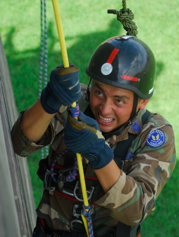 SOTO CANO AIR BASE, Honduras - A Honduran Airman negotiates the repelling tower during a training exercise Aug. 28. The Joint Task Force-Bravo fire department trained with Honduran Air Force and local fire fighters Aug. 25-28 on activities that varied from land navigation to rescue operations. (U.S. Air Force photo by Staff Sgt. Joel Mease)