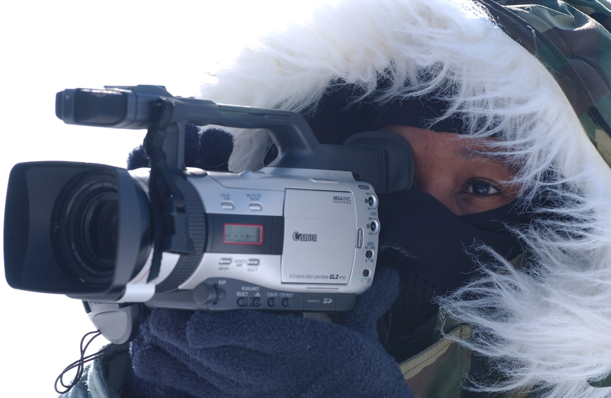 Tech. Sgt. Latisha Cole, 354th Fighter Wing Public Affairs NCO in charge of broadcasting, captures the Eielson mission in sub-arctic weather in early 2008. (U.S. Air Force photo by Airman 1st Class Jonathan Snyder)