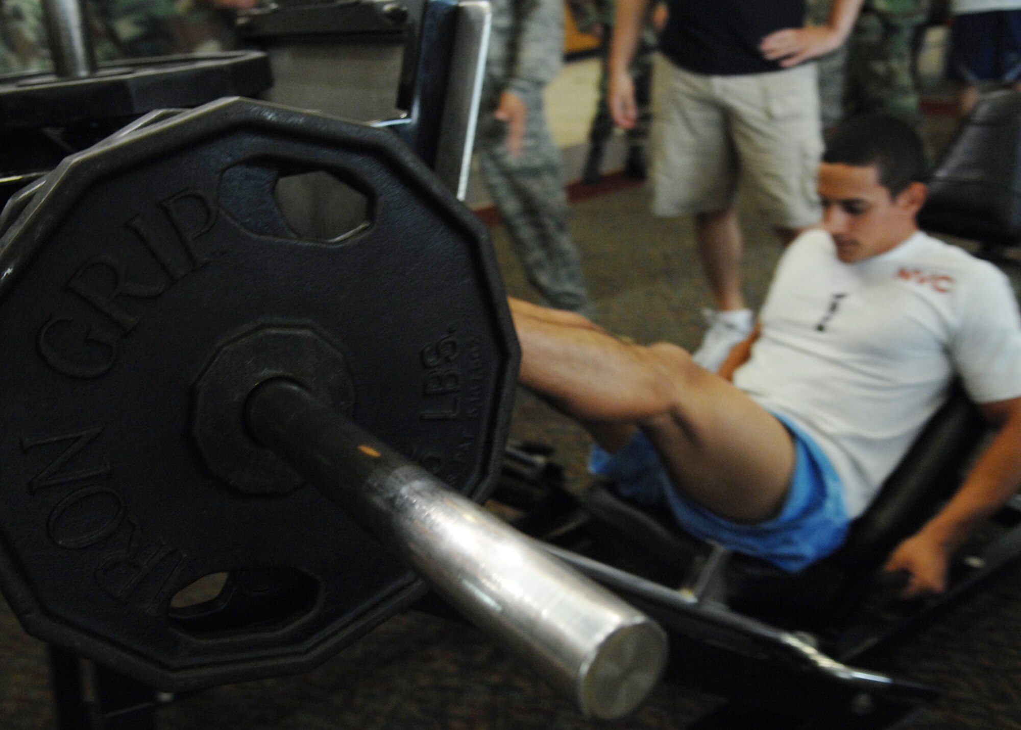 Airman 1st Class Emmanuel Rodriguez, 49th Medical Group, competes in the leg press portion the Iron Airman Challenge at Holloman Air Force Base, N.M., Aug. 27. Airman Rodriguez completed 111 leg press repetitions of 270 pounds during the competition. (U.S. Air Force photo/ Senior Airman Anthony Nelson Jr)