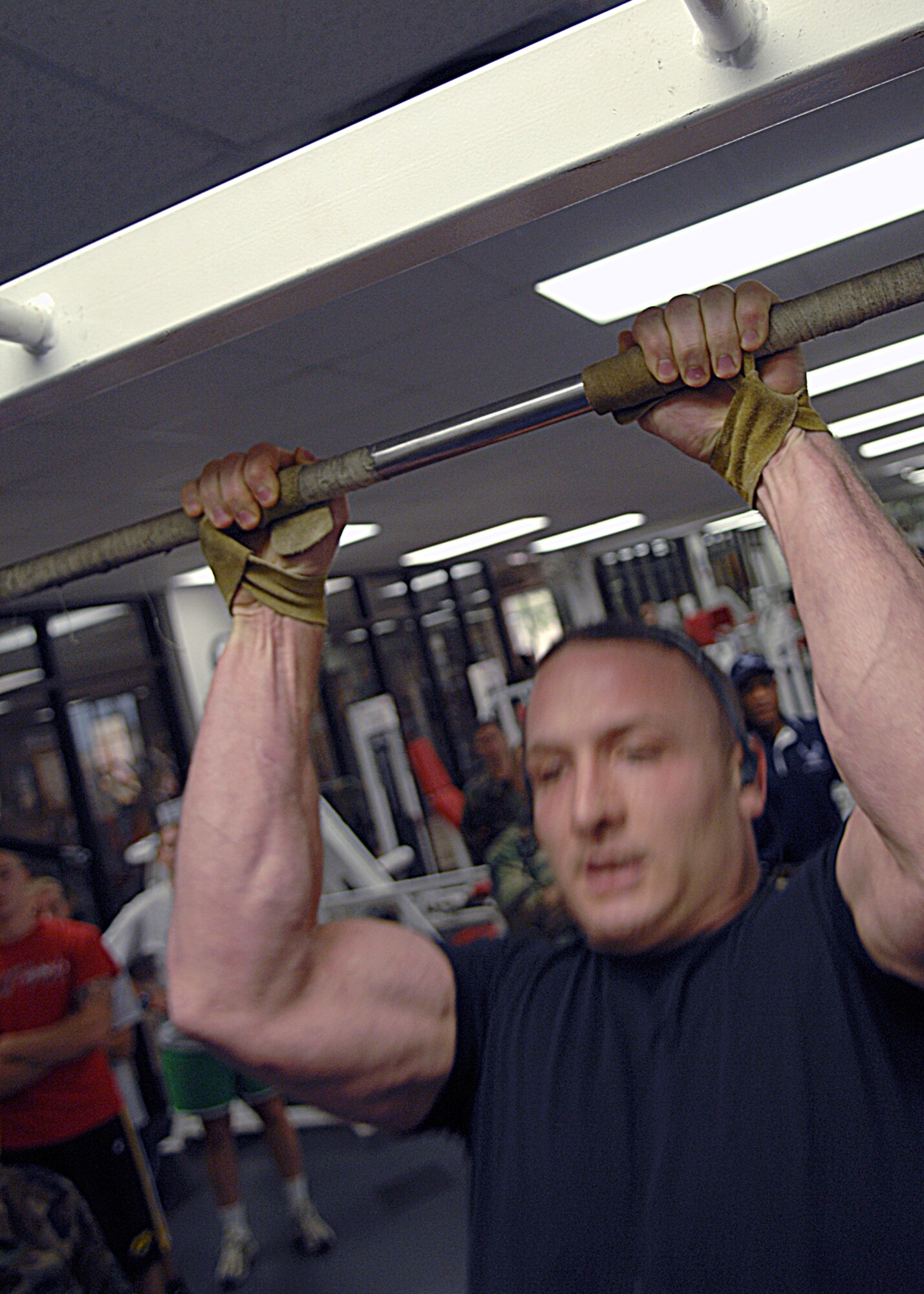 Senior Airman Thomas McConnell, does pull-ups during the Iron-Airman Challenge Aug. 27 at Holloman Air Force Base, N.M. The participants competed in various events during the competition. Participants had two minutes to complete as many pull-ups as possible.

(U.S. Air Force photo/Senior Airman Anthony Nelson Jr)
