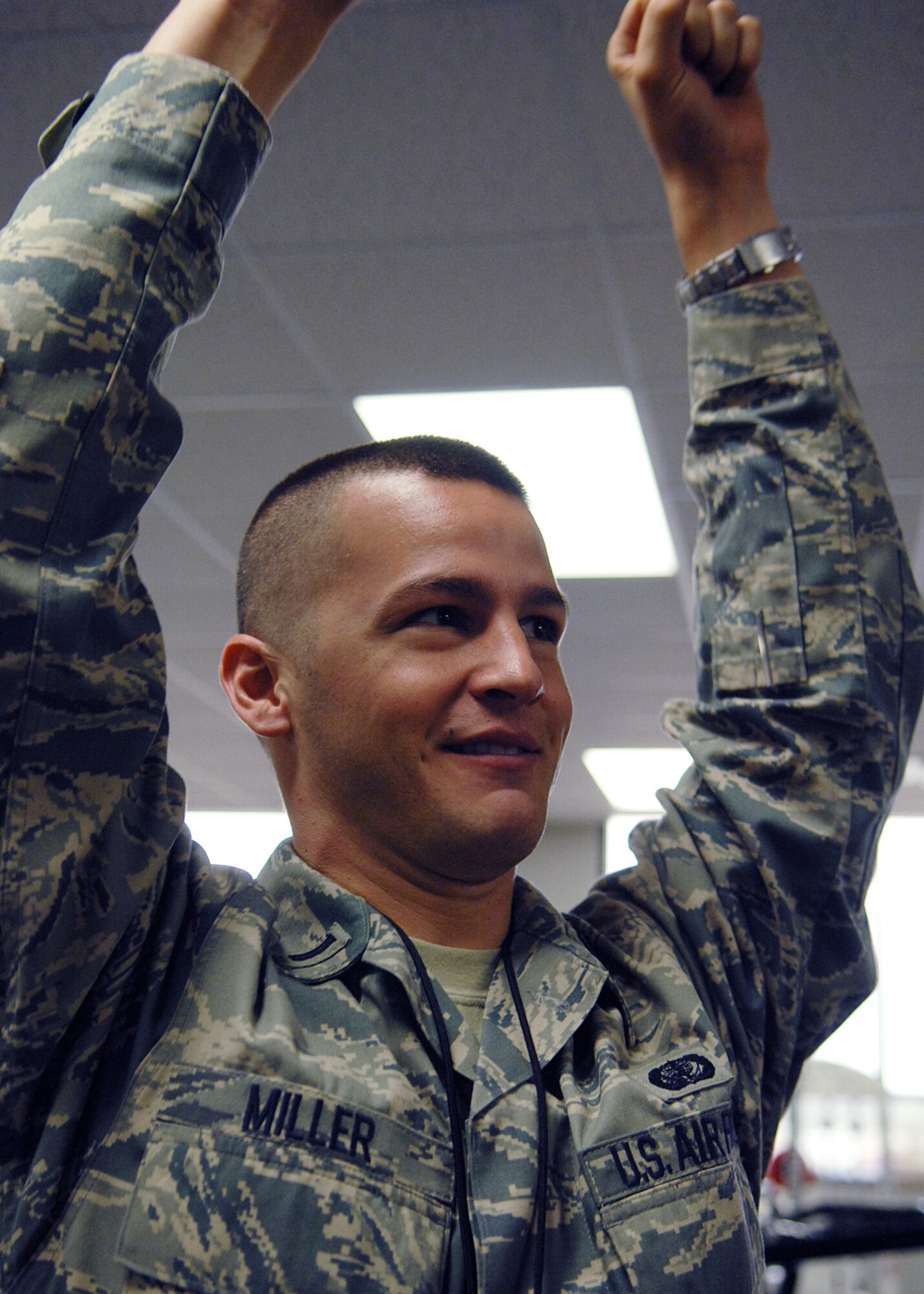 1st. Lt. Ronald Miller, Fitness center Officer in charge (OIC) demonstrates the proper pull-up during the 2nd Iron-Airman Challenge Aug. 27 at Holloman Air Force Base, N.M. Participants had two minutes to complete as many pull-ups as possible. The competition rewards the team with the highest level of fitness on a point scale with a trophy.

(U.S. Air Force photo/Senior Airman Anthony Nelson Jr)
