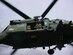 A 305th Rescue Squadron flight engineer prepares to hoist a simulated survivor using the 600 pound capacity hydraulic hoist on a HH-60 Pave Hawk helicopter during a training exercise. (Courtesy photo)