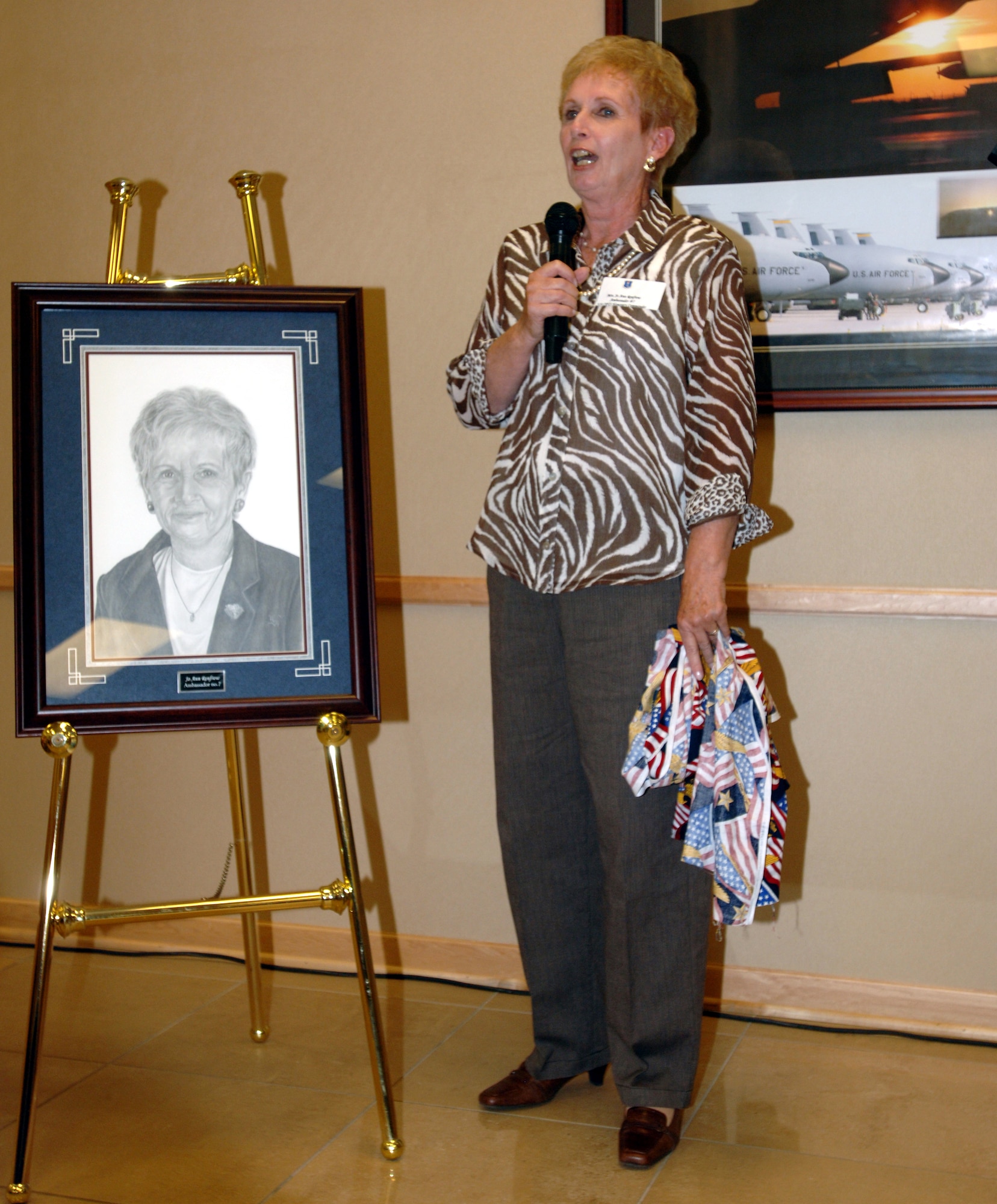 Mrs. Jo Ann Renfrow speaks to the audience during a ceremony honoring her as the wing's newest ambassador. Mrs. Renfrow is the seventh person proclaimed a wing ambassador since the program's induction.  Wing ambassadors are business and civic leaders from the local community who have demonstrated outstanding and continual support of the base, its mission and its Airmen.  Ambassadors represent the community and the base during wing events and also during meetings with senior Air Force and political leaders. (U.S. Air Force photo/Tech. Sgt. Joseph Kapinos)