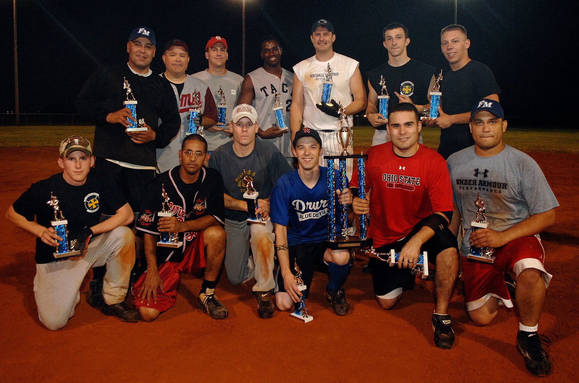 LANGLEY AIR FORCE BASE, Va. -- Members of the 1st Communications Squadron softball team gather for a team picture after defeating the 1st Equipment Maintenance Squadron 18-15 in the base championship, Aug. 28.  1st Comm was the clear underdog in the competition, but managed to give the 1st EMS their first lost of the season.  (U.S. Air Force photo/Senior Airman Vernon Young)